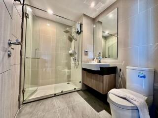 Modern bathroom with glass-enclosed shower and vanity