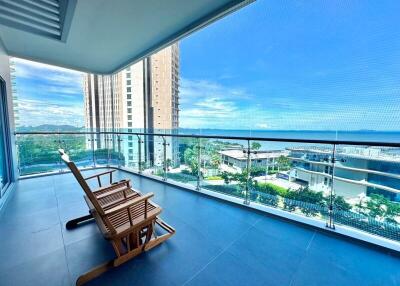 Spacious balcony with seating and ocean view