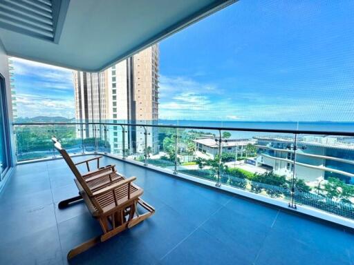 Spacious balcony with seating and ocean view