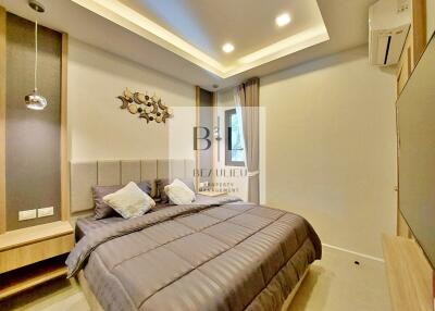 Modern bedroom with bed, pillows, and decorative elements