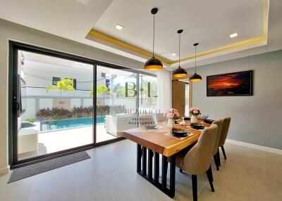 Modern dining area with pool view