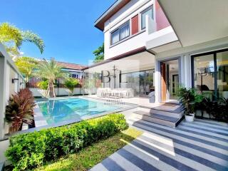 Modern home with a pool and garden