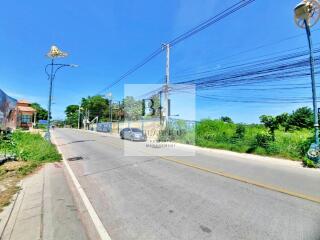 Quiet suburban street with clear skies