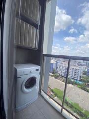 Washing machine on a balcony with a city view