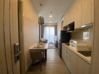 Modern kitchen with dining area and living room view