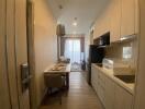 Modern kitchen with dining area and living room view