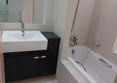 Modern bathroom with sink and bathtub