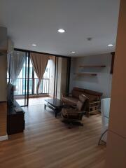 modern living room with wooden flooring and balcony