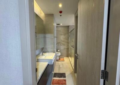 Modern bathroom with glass shower and double sinks