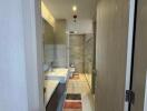 Modern bathroom with glass shower and double sinks