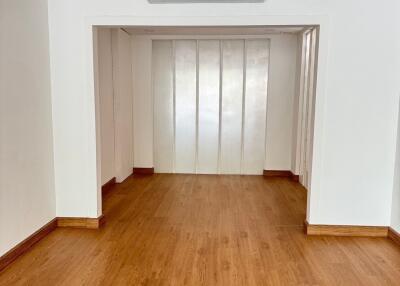 Empty room with wooden floor and air conditioner on 1st floor