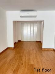 Empty room with wooden floor and air conditioner on 1st floor