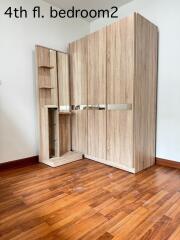 4th floor bedroom with wooden wardrobe