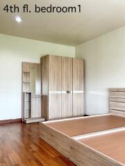 Spacious bedroom with wooden furniture