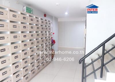 Mailboxes in a hallway with a staircase