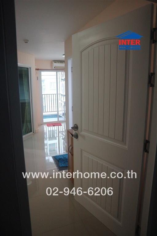 front door with view of living space