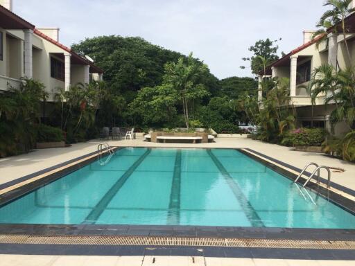 Bright swimming pool area in a residential complex