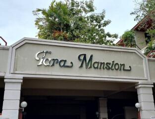 Entrance of Tara Mansion with signage