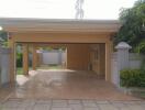 Covered garage with surrounding greenery