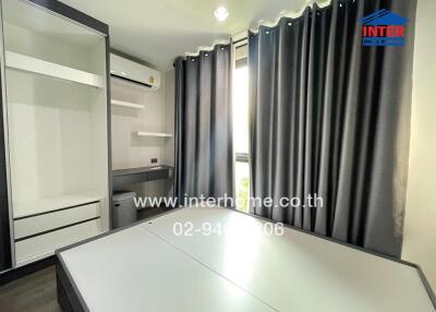 Bedroom with curtains, built-in wardrobe, air conditioner