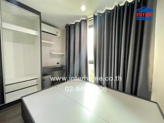 Bedroom with curtains, built-in wardrobe, air conditioner