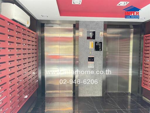 Elevator lobby area with mailboxes