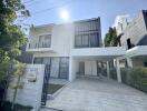 Modern two-story house with a driveway and front lawn