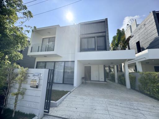 Modern two-story house with a driveway and front lawn