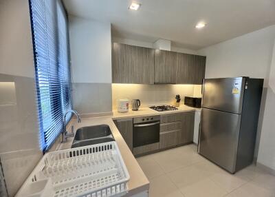 Modern kitchen with stainless steel appliances and gray cabinets