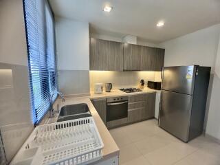 Modern kitchen with stainless steel appliances and gray cabinets