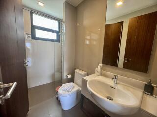 Modern bathroom with enclosed shower and vanity sink