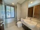 Modern bathroom with large mirror and glass shower