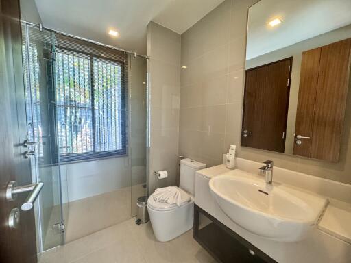 Modern bathroom with large mirror and glass shower