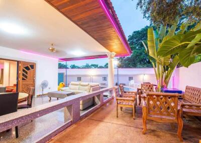 Spacious and well-furnished patio area with outdoor seating