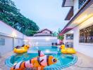 Outdoor swimming pool with inflatable toys