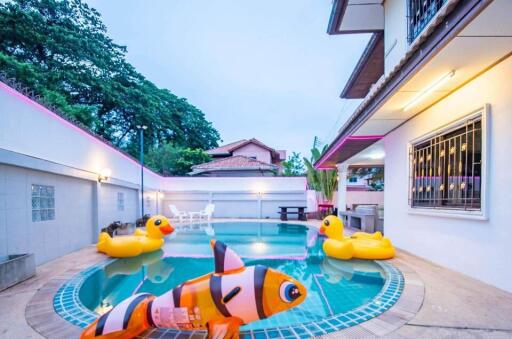 Outdoor swimming pool with inflatable toys