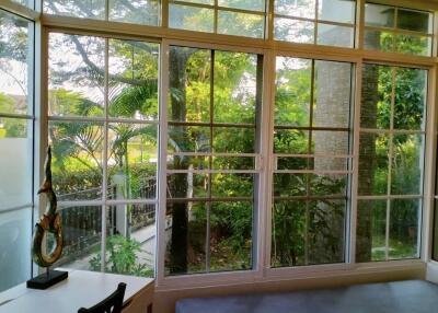 Living room with large windows and garden view