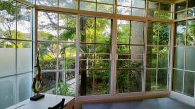 Living room with large windows and garden view