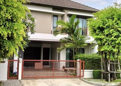 Modern two-story house with a garden