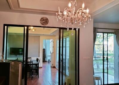 Elegant living room with chandelier and sliding doors