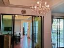 Elegant living room with chandelier and sliding doors