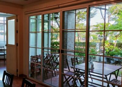 Living area with large glass sliding doors opening to an outdoor patio