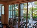 Living area with large glass sliding doors opening to an outdoor patio