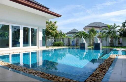 Swimming pool with surrounding houses