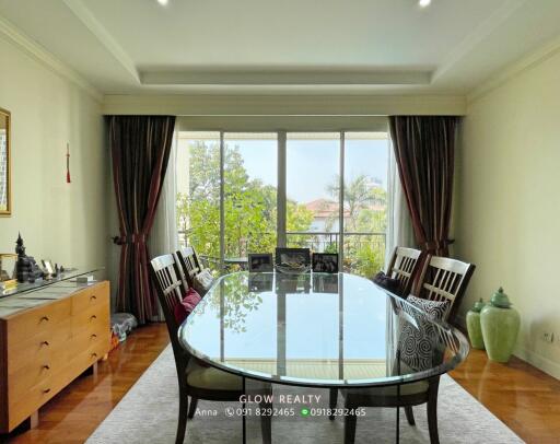 Spacious dining room with large glass table and chairs
