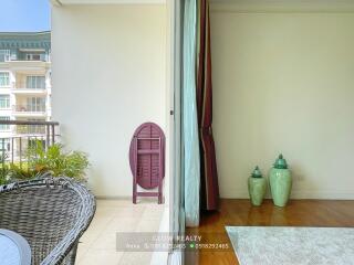 Well-lit living area adjacent to a balcony