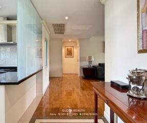 Bright and spacious living room with wooden flooring and decor