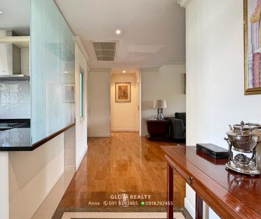 Bright and spacious living room with wooden flooring and decor