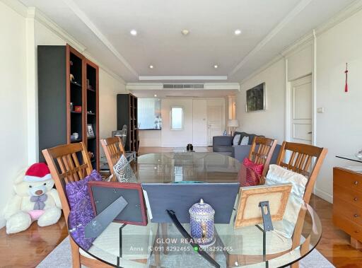 Bright and spacious living room with dining table and modern decor