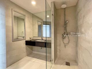 Modern bathroom with glass shower and vanity